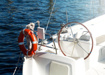 Closeup Of Beautiful Yacht Rudder. Daylight. Horizontal. Sea Bac