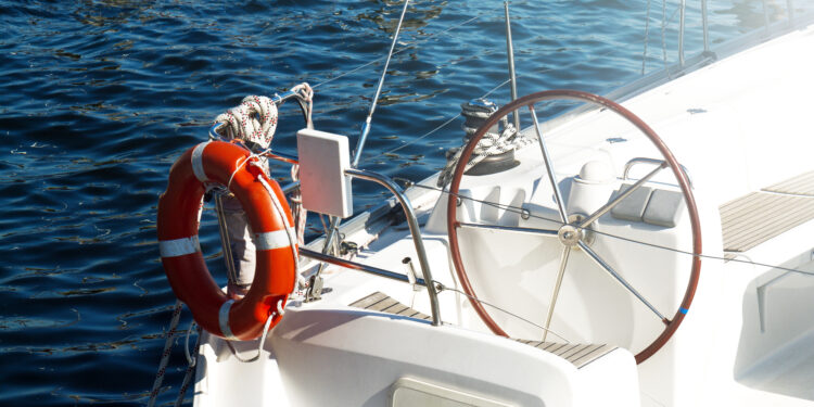 Closeup Of Beautiful Yacht Rudder. Daylight. Horizontal. Sea Bac